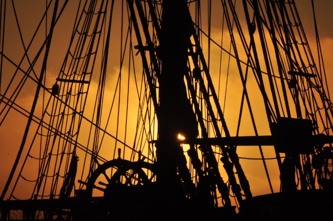 ship in silhouette at the harbor